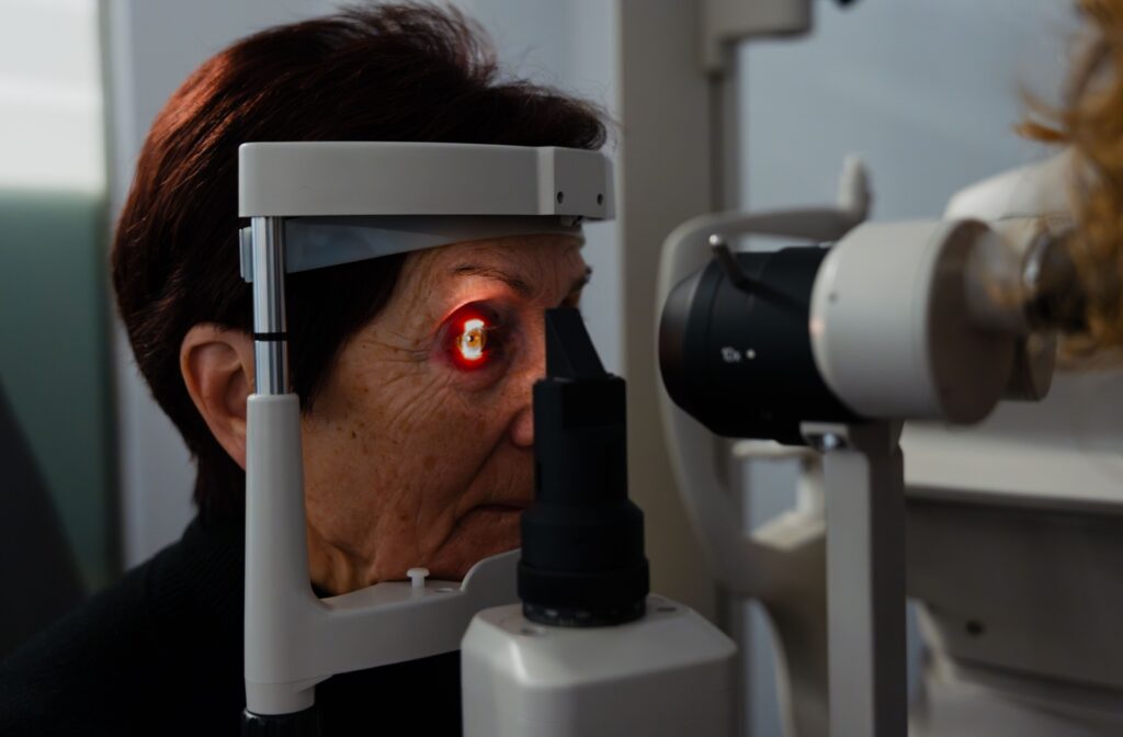 An optometrist evaluates a patient's eye health with a slit lamp during their annual eye exam.